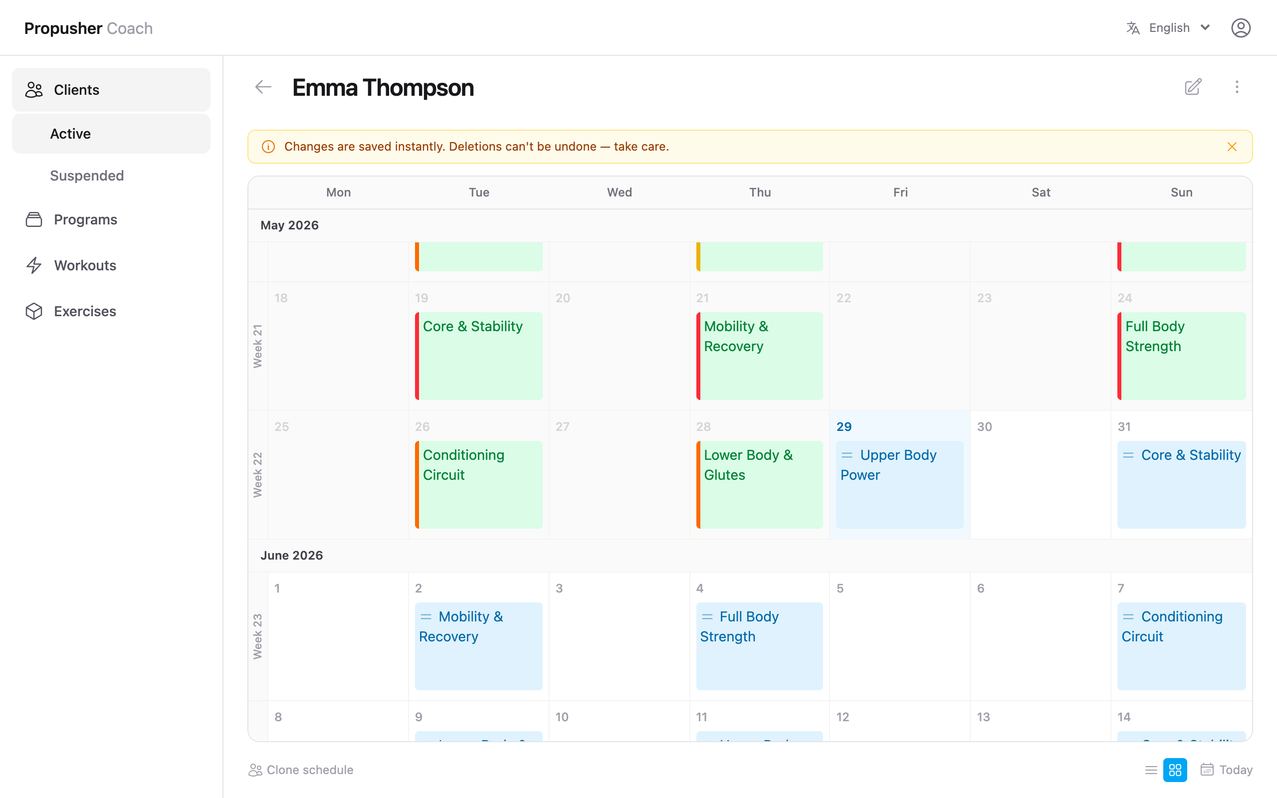 Client calendar showing today highlighted sky-blue and two skipped workouts shown in red